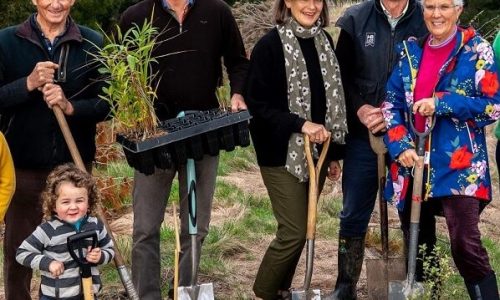 Image: Mucking in to mark the milestone, a group of Hawke's Bay Foundation cornerstone donor families, from left to right: Annabel Murphy and children Tillie (8) and Marco (3), James Williams, Tim and Jules Nowell-Usticke, Craig Hickson and wife Penny with daughter Anna Ducker and granddaughter Greer and pictured far right, Lyn Williams. (Image courtesy of Richard Brimer)